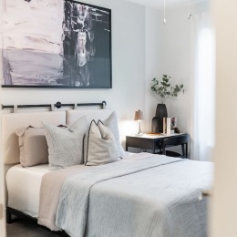 a bedroom with a bed and a nightstand