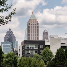 a city with tall buildings and trees