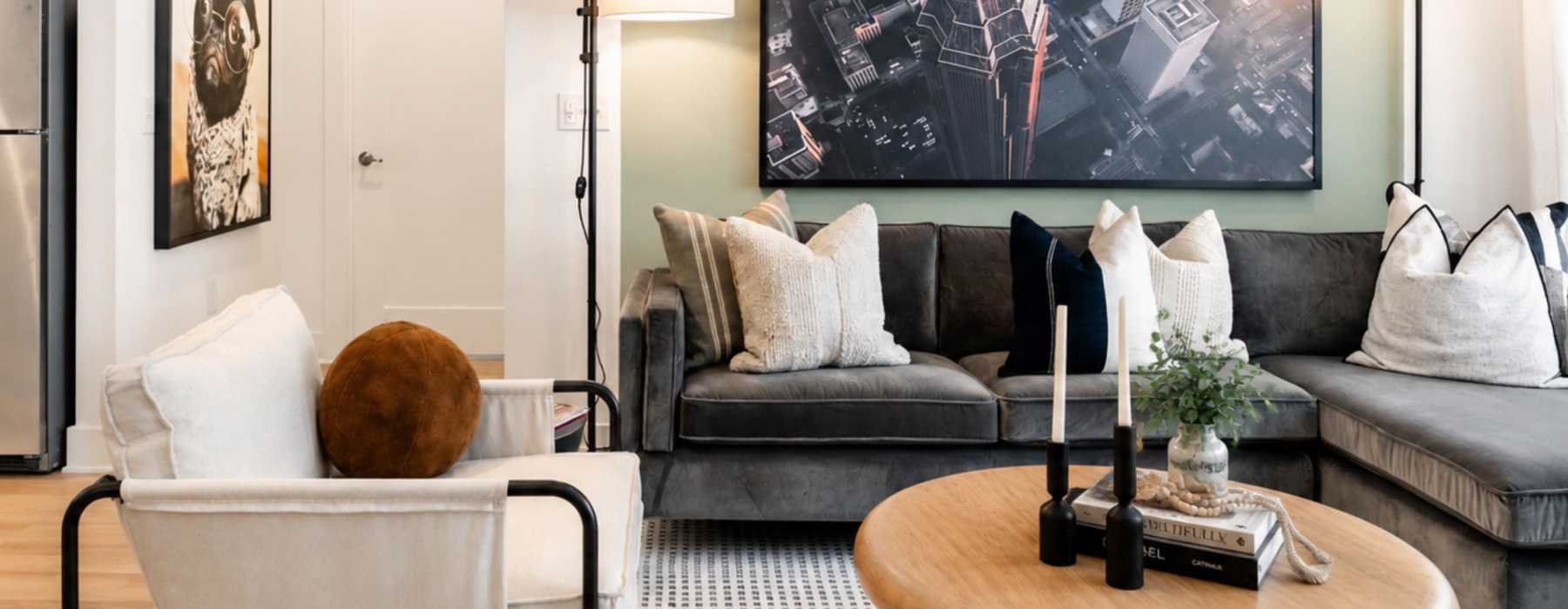 a living room with a couch, chair and coffee table