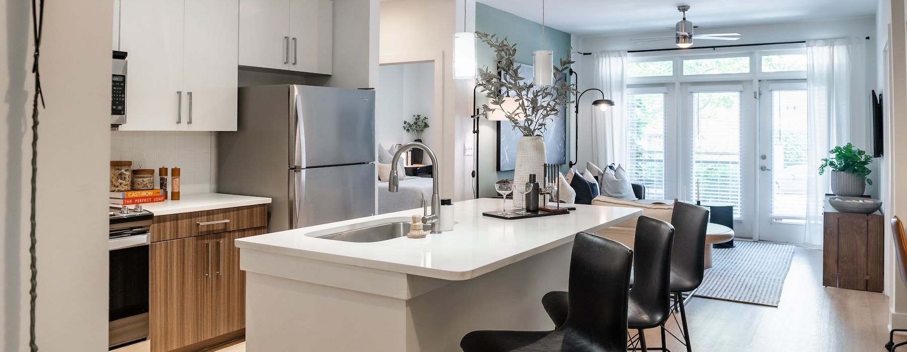 a kitchen with an island and chairs