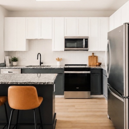 a kitchen with white cabinets